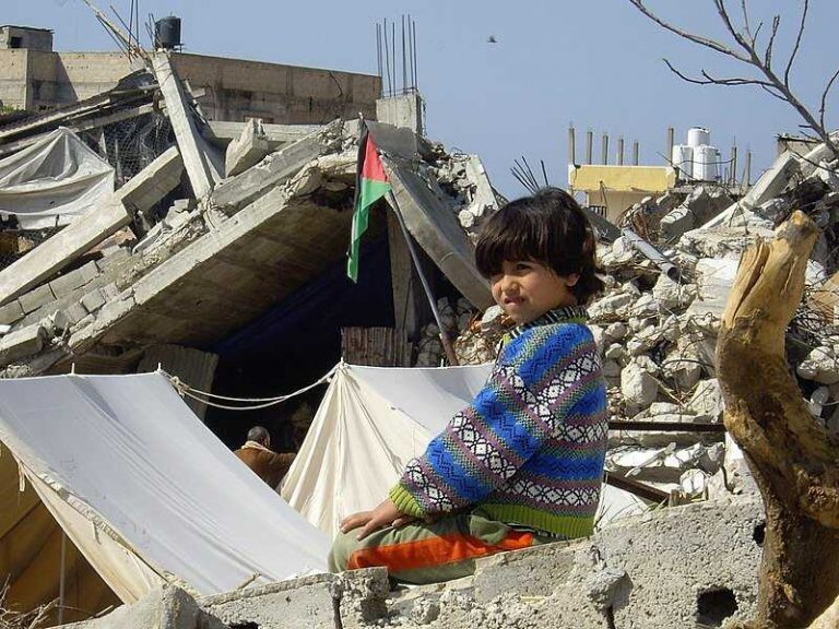 Child_in_the_ruins_after_the_2009_Gaza_War